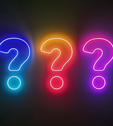 Question marks representing evaluating a sales enablement software