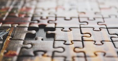 puzzle representing LMS implementation project plan and free checklist