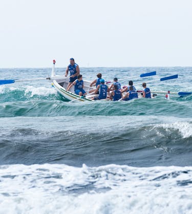 Men in boat representing management coaching